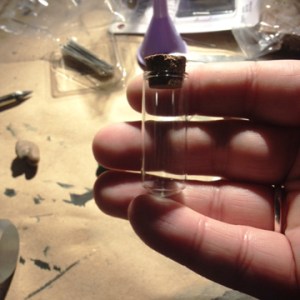 Prepare your tiny glass vial by washing it inside and out and allowing to air dry.