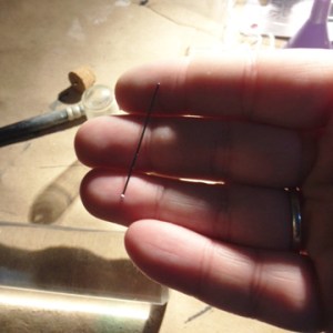 You will need a head pin to create a hook in the top of your snow globe ornament.