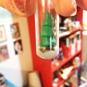 Situate your tree so that it is straight and looks the way you would like it to and allow grout to cure for full time. Once cured you can add a small amount of glitter, a few drops of glycerin, and distilled water. Place cork in top and dip top in sealing wax to ensure a good seal.