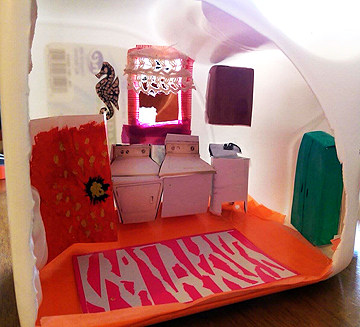 And here is her adorable little laundry room diorama made inside a laundry detergent jug.