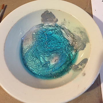 Mix up your paint solution, which is two parts acrylic paint to one part dish washing liquid.