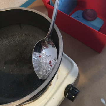 They become clear almost immediately after being submerged but you will need to wait about two minutes before removing the blob of plastic (you can see the tiny color beads in this batch).